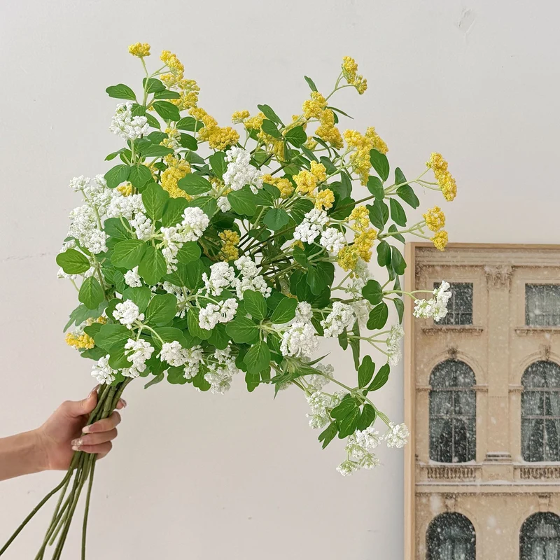 Artificial blossom branch with purple flowers