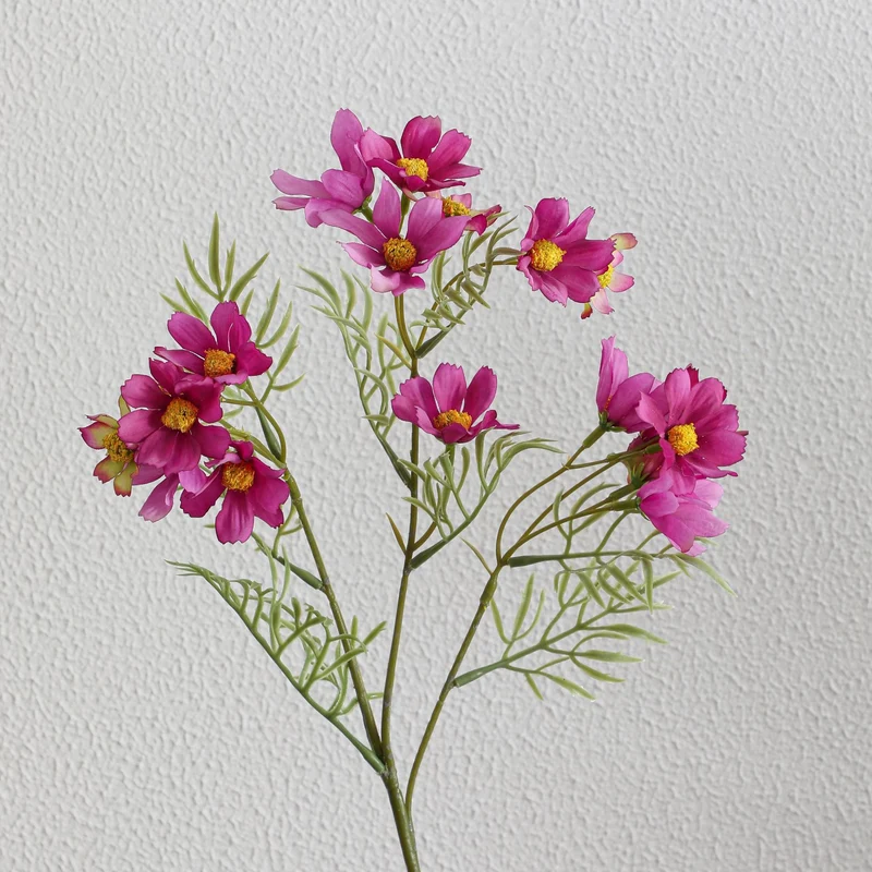 Artificial flower branch with bright pink flowers
