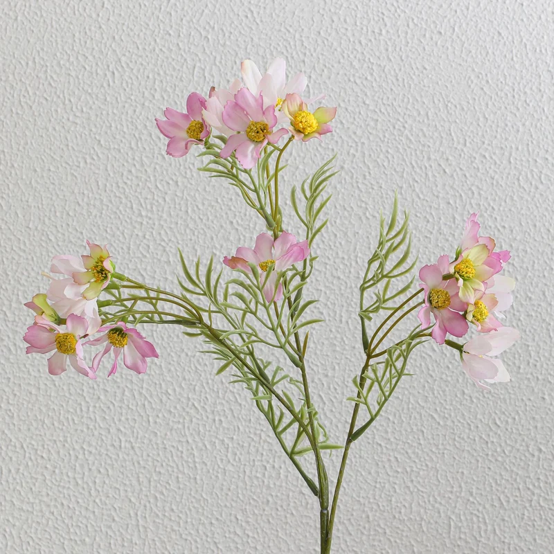 Artificial flower branch with bright pink flowers