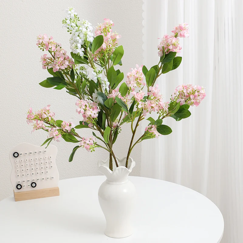 Artificial flower branch with bright flowers