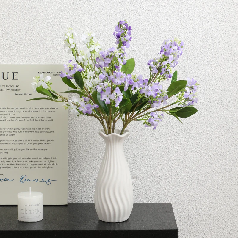 Artificial flower branch with bright flowers