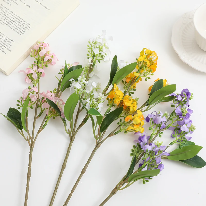 Artificial flower branch with bright flowers