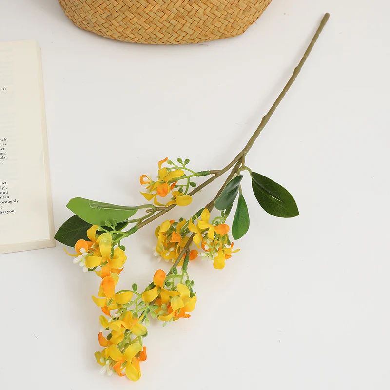 Artificial flower branch with bright flowers