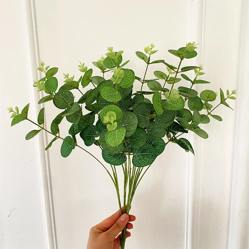 Artificial flowering branch with lifelike leaves and delicate flowers