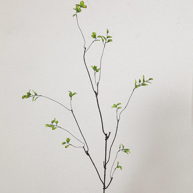 Artificial flower branch with vibrant orange flowers