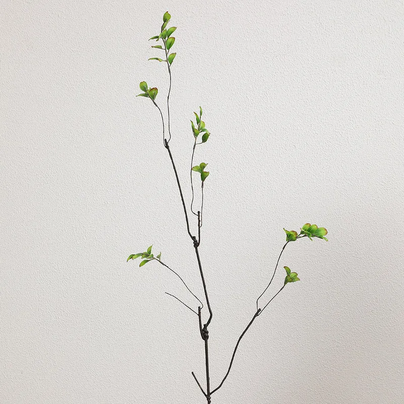 Artificial flower branch with vibrant orange flowers