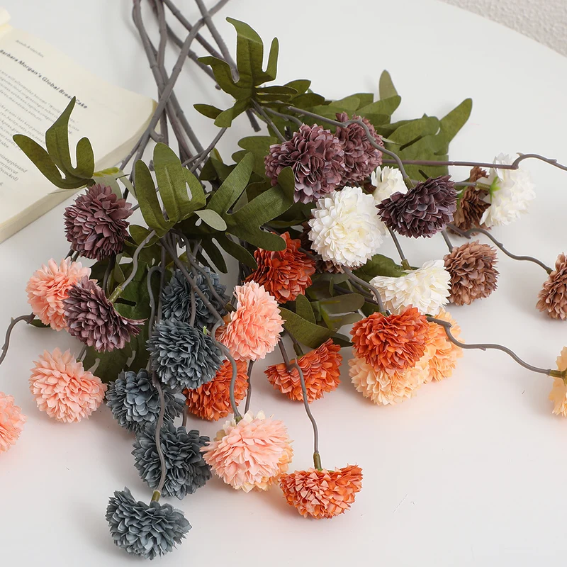 Artificial flower branch with intricate flowers