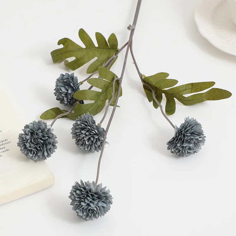 Artificial flower branch with intricate flowers