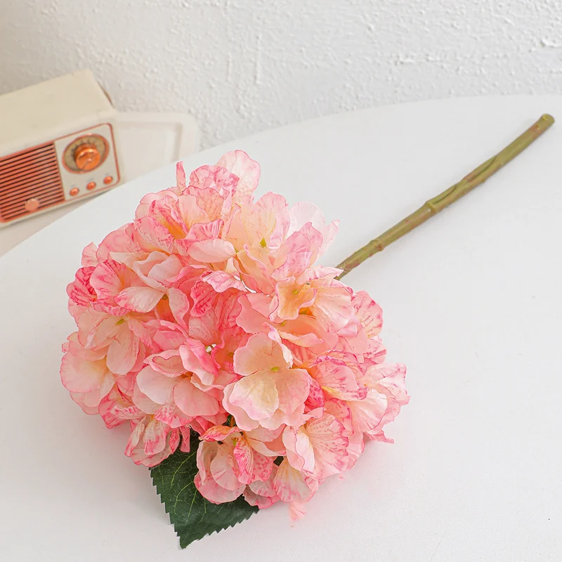 Artificial flower branch with realistic flowers