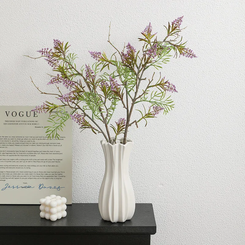 Artificial plant with decorative flowers