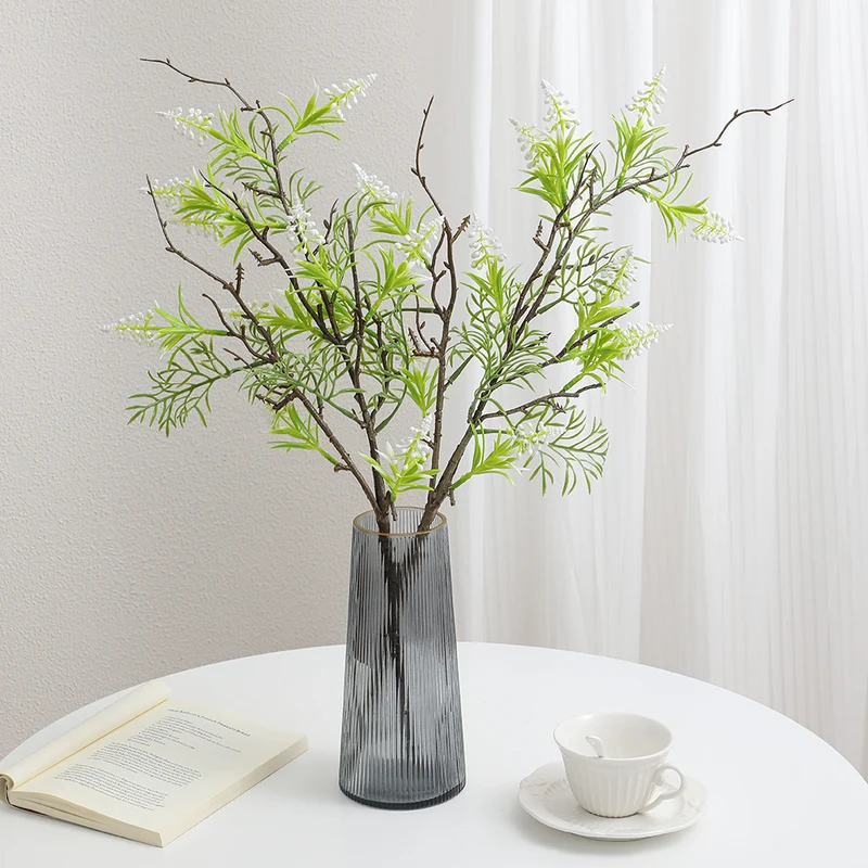 Artificial plant with decorative flowers