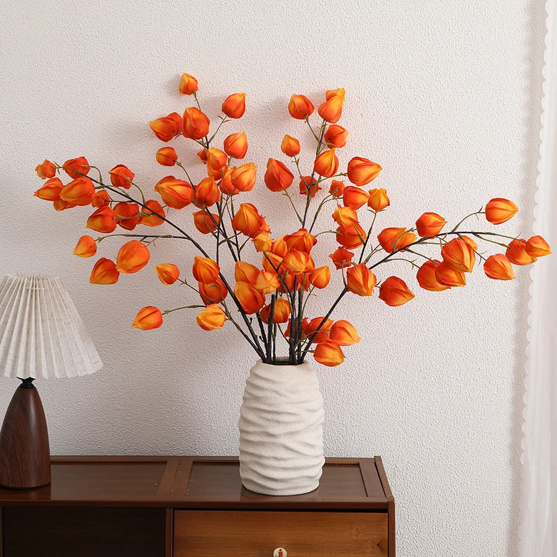 Artificial flower branch with vibrant flowers