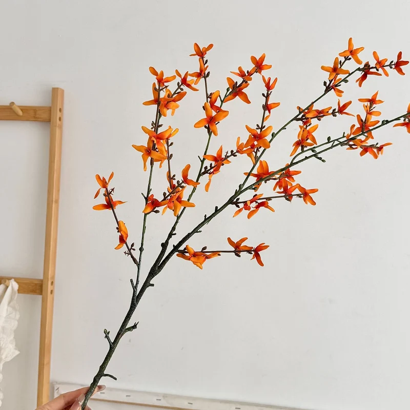 Artificial flower branch with intricately detailed yellow flowers