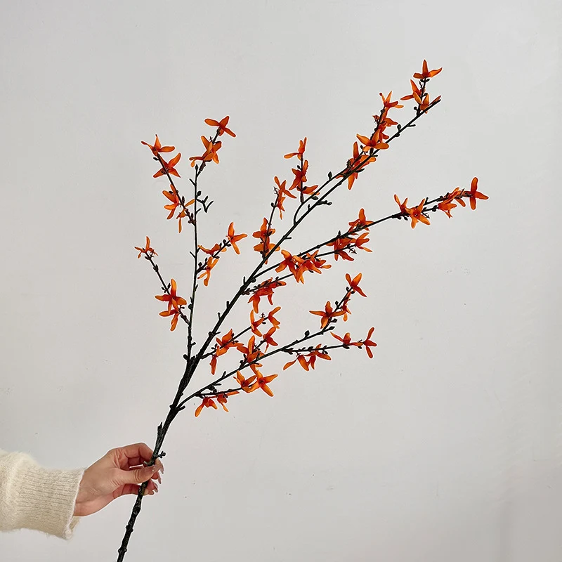 Artificial flower branch with intricately detailed yellow flowers