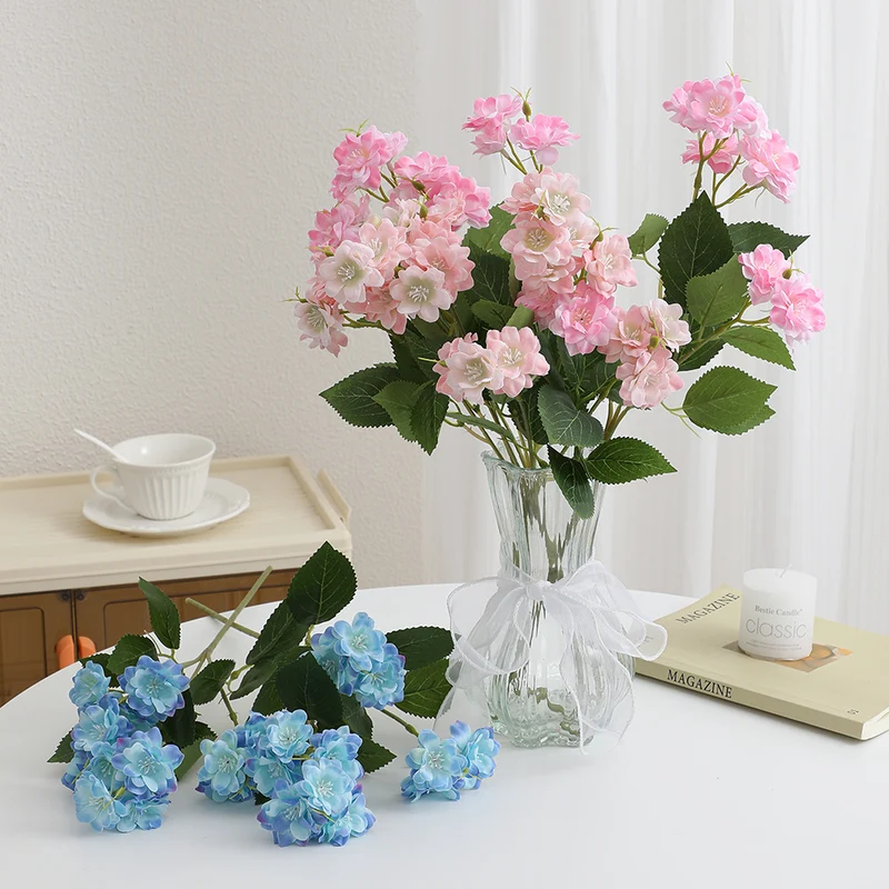 Artificial flower arrangement with delicate white blooms