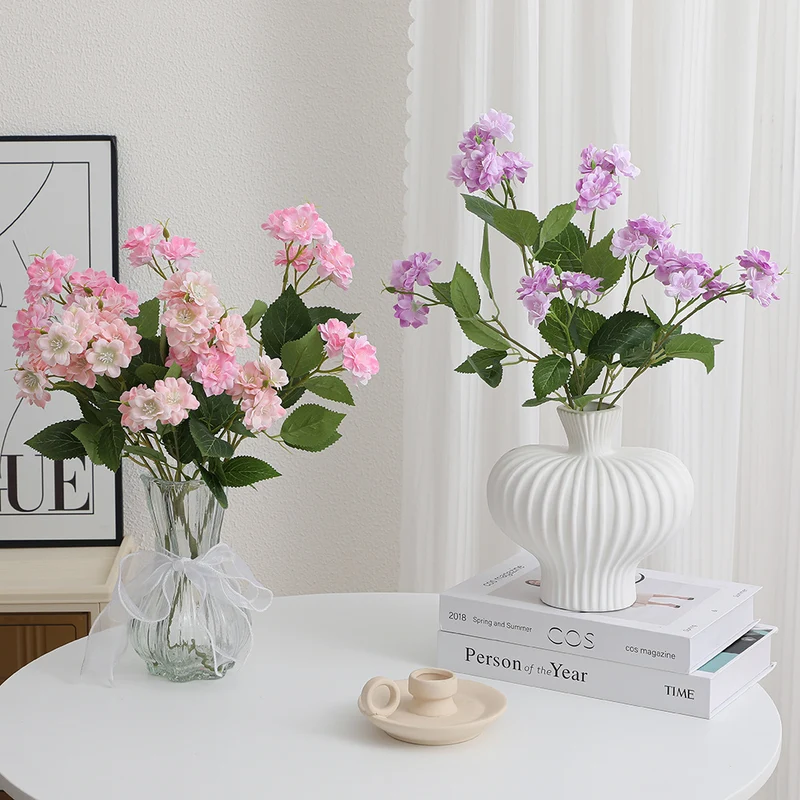 Artificial flower arrangement with delicate white blooms