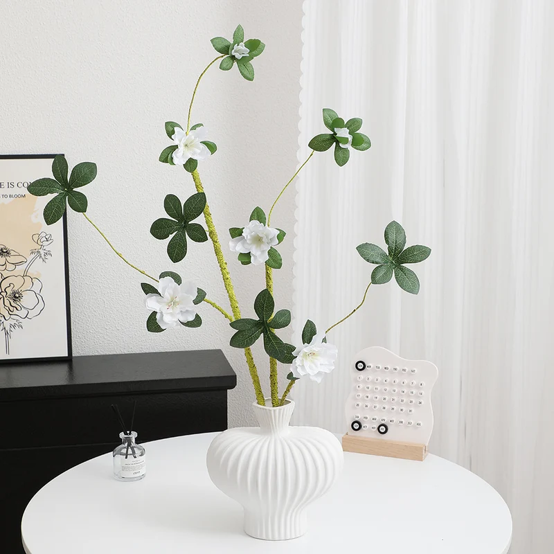 More elegant artificial flower branch with realistic blooms and leaves