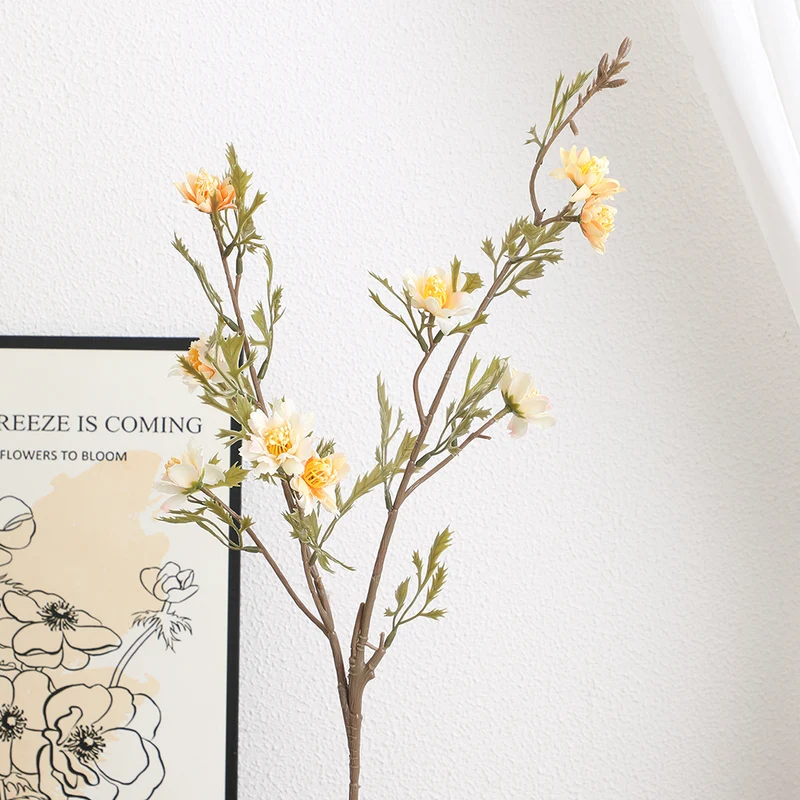 Elegant artificial flower branch with detail-loving blossoms