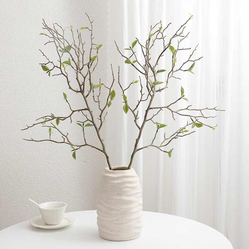 Decorative art branch with natural leaves