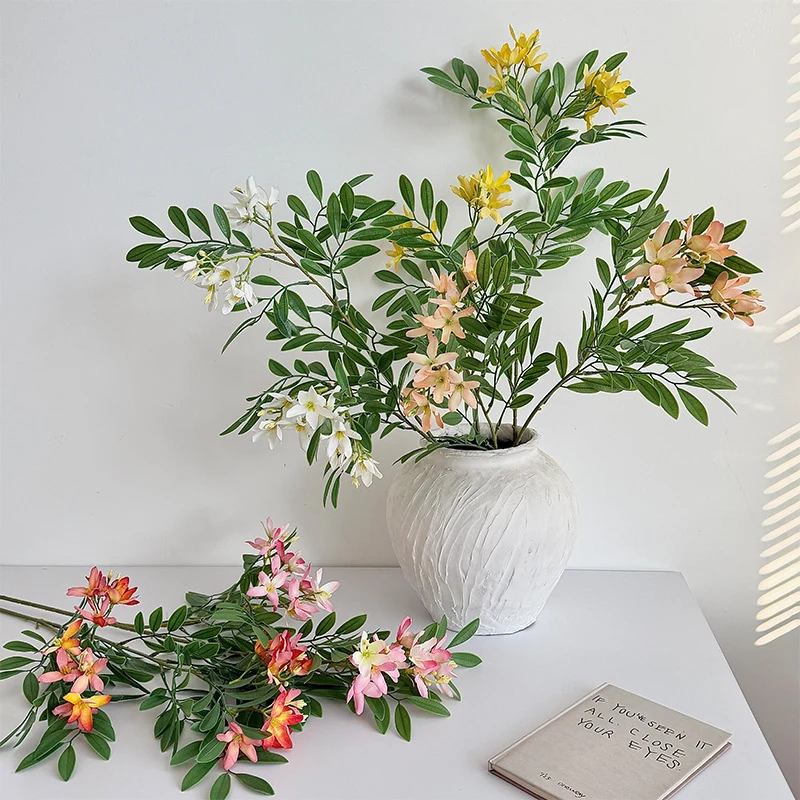 Decorative artificial flower branch with delicate flowers