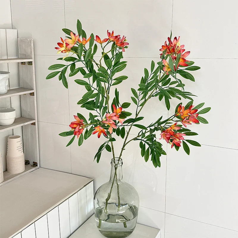 Decorative artificial flower branch with delicate flowers