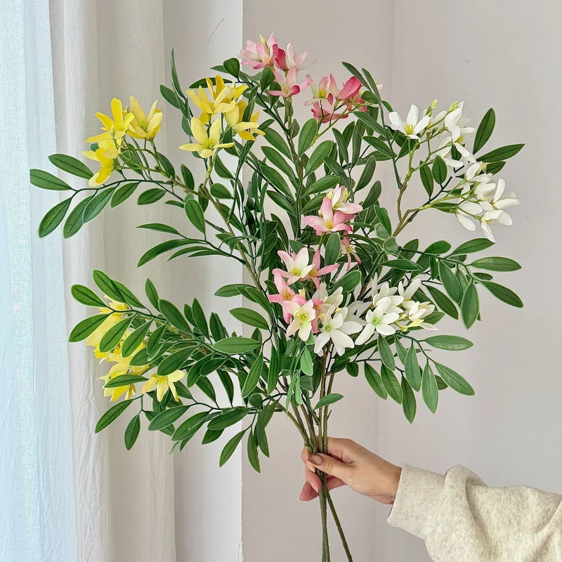 Decorative artificial flower branch with delicate flowers