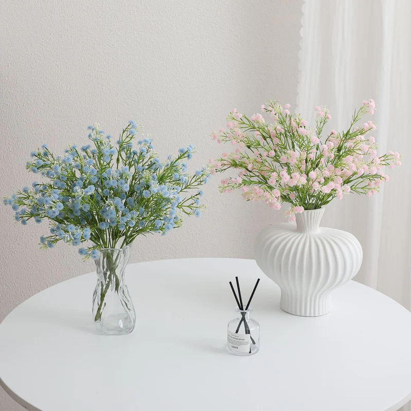 Decorative artificial flower branch with delicate purple flowers