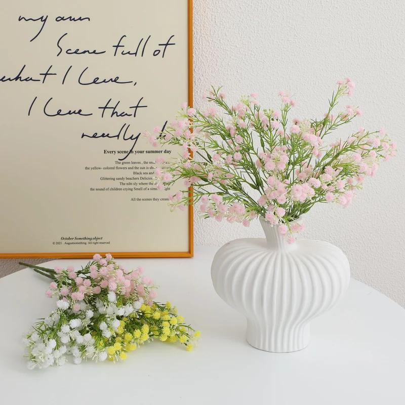 Decorative artificial flower branch with delicate purple flowers