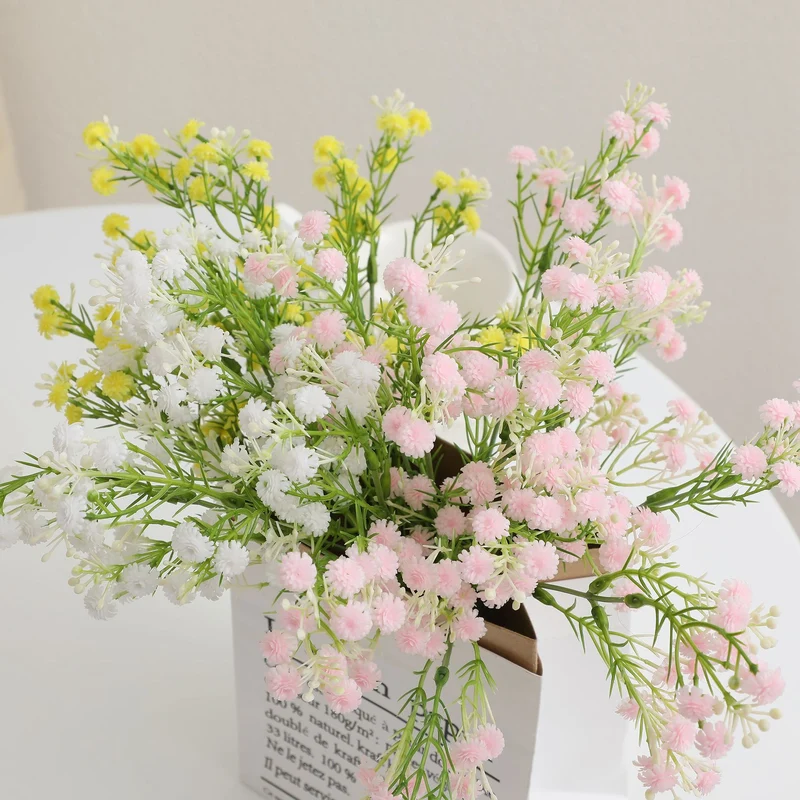 Decorative artificial flower branch with delicate purple flowers