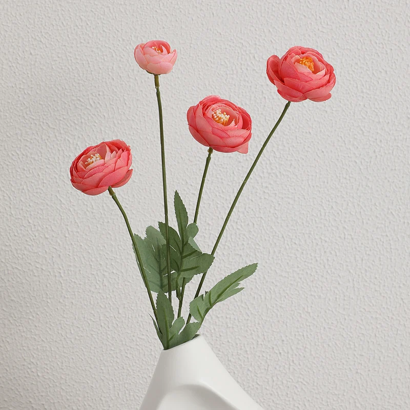 Decorative artificial flower bouquet with intricately detailed ranunculus