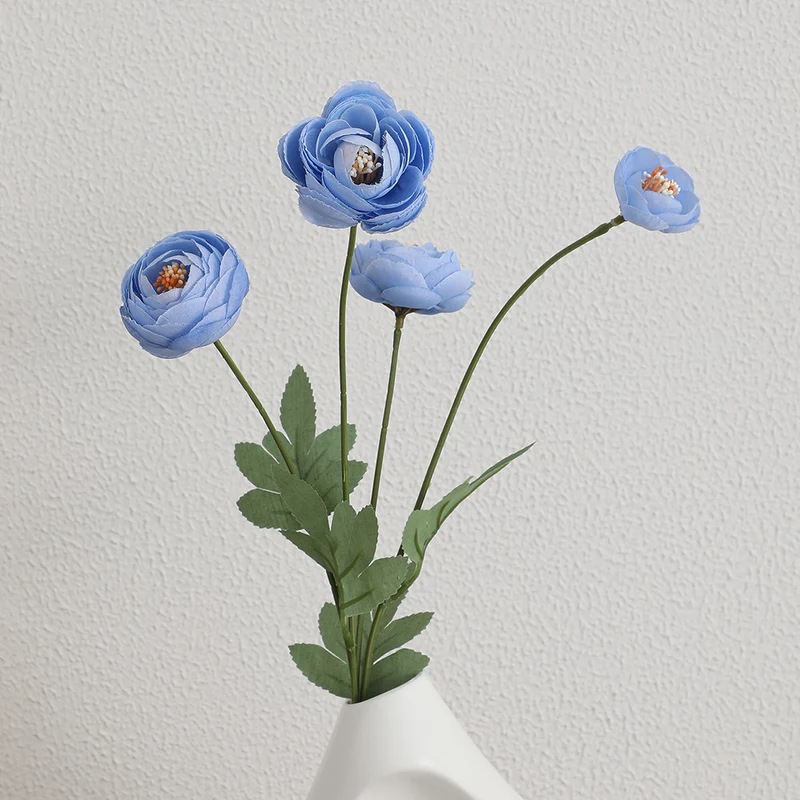 Decorative artificial flower bouquet with intricately detailed ranunculus
