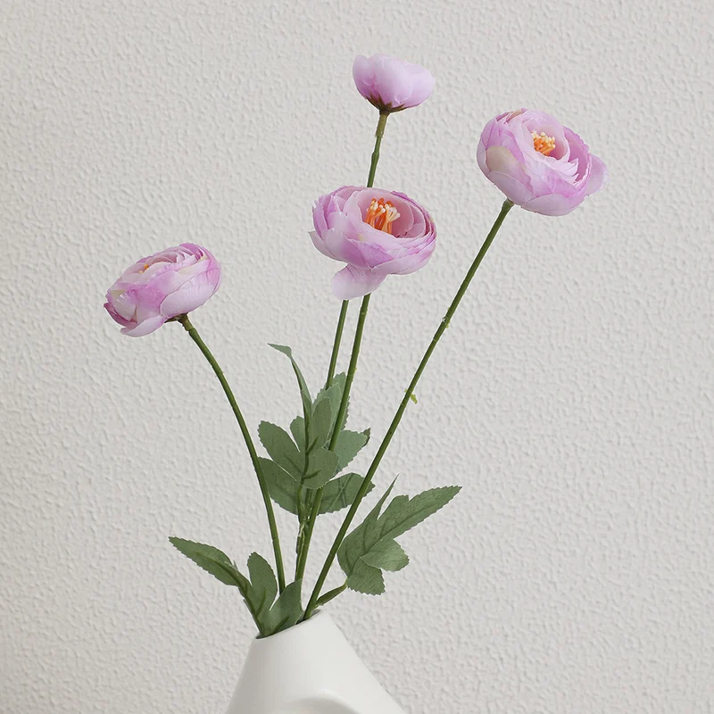 Decorative artificial flower bouquet with intricately detailed ranunculus