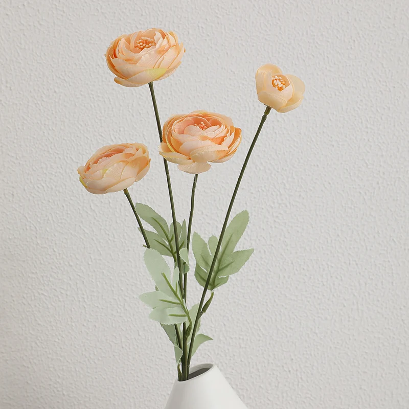 Decorative artificial flower bouquet with intricately detailed ranunculus