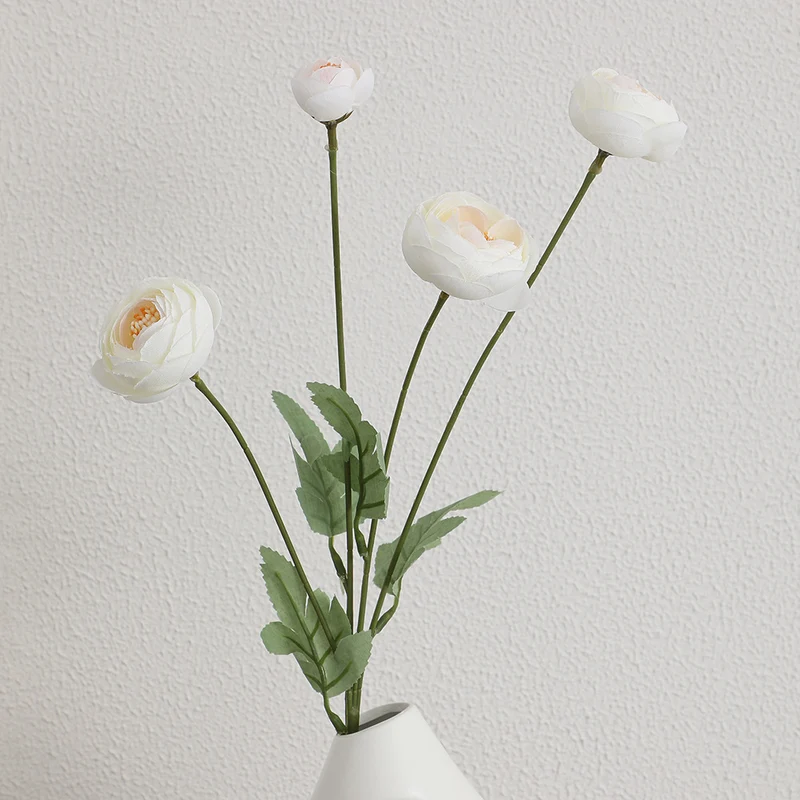 Decorative artificial flower bouquet with intricately detailed ranunculus