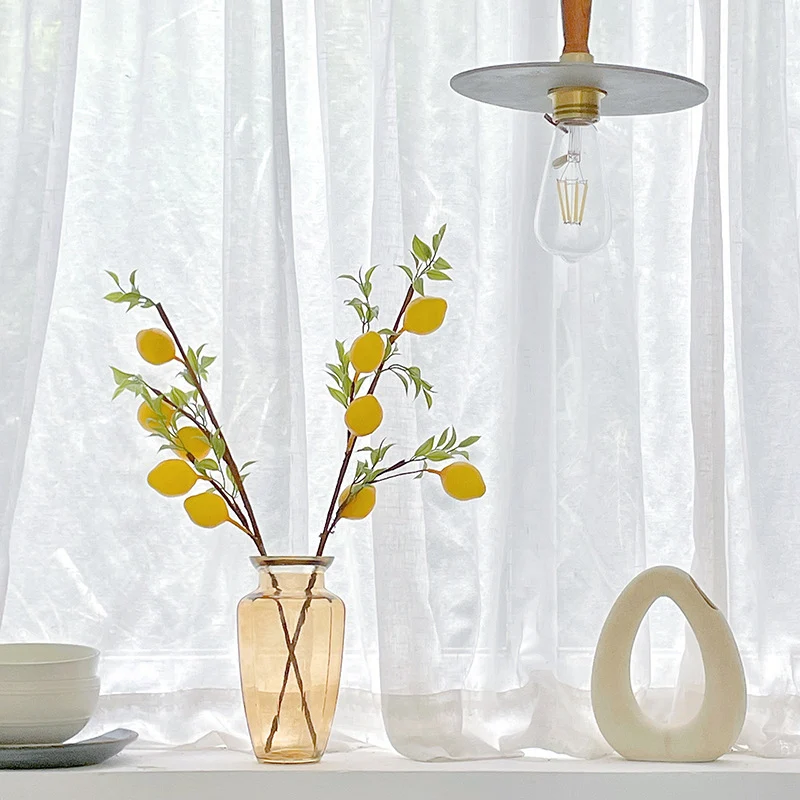 Decorative branch with artificial lemons