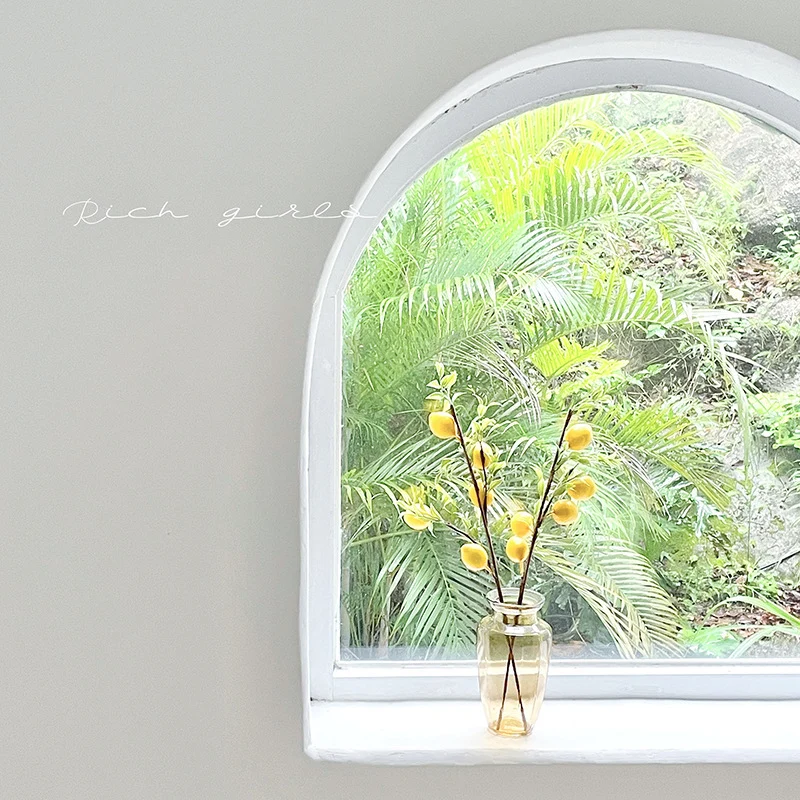 Decorative branch with artificial lemons