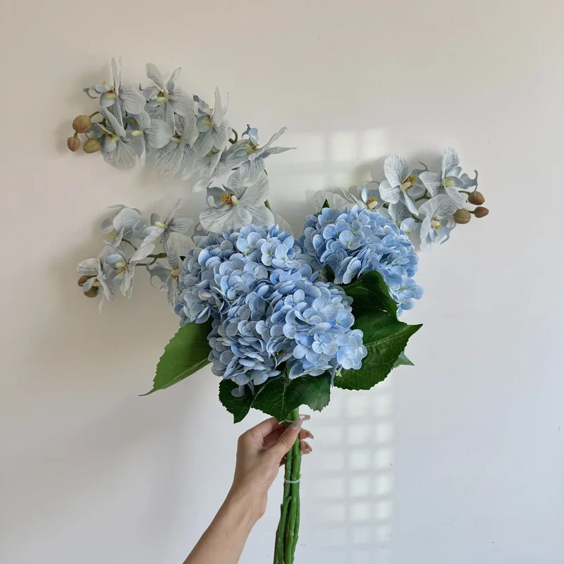 Luxurious artificial flower bouquet with blooming orchids