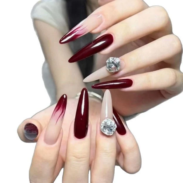 Elegant Stiletto Nail Enhancements with Gem Accents Stornfield