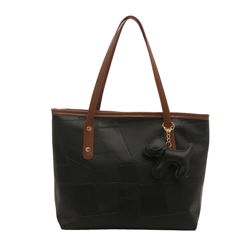 Stylish Textured Tote Bag with Decorative Charm