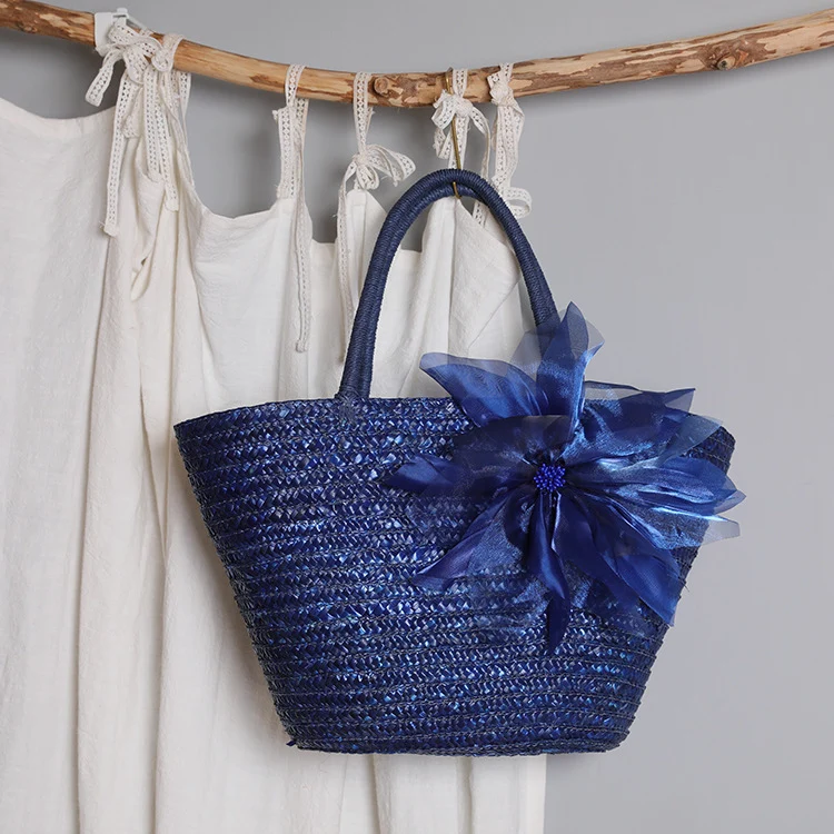 Stylish basket bag with eye-catching flower detail Stornfield