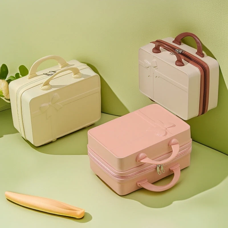structured hard-shell cosmetic travel case with embossed bow and dual top handles Stornfield