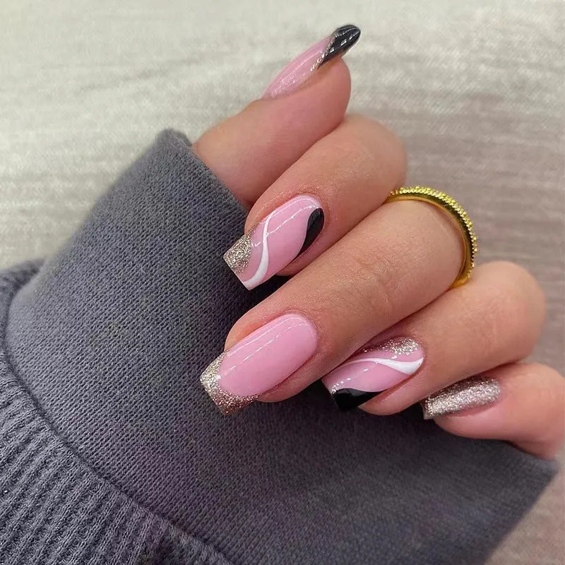 Trendy Nail Art with Glitter and Wave Accents Stornfield