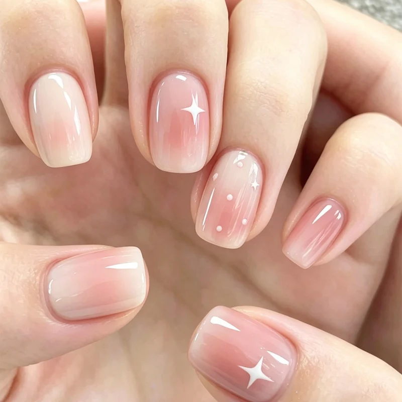 Nail art with ombre effect and glitter accents Stornfield