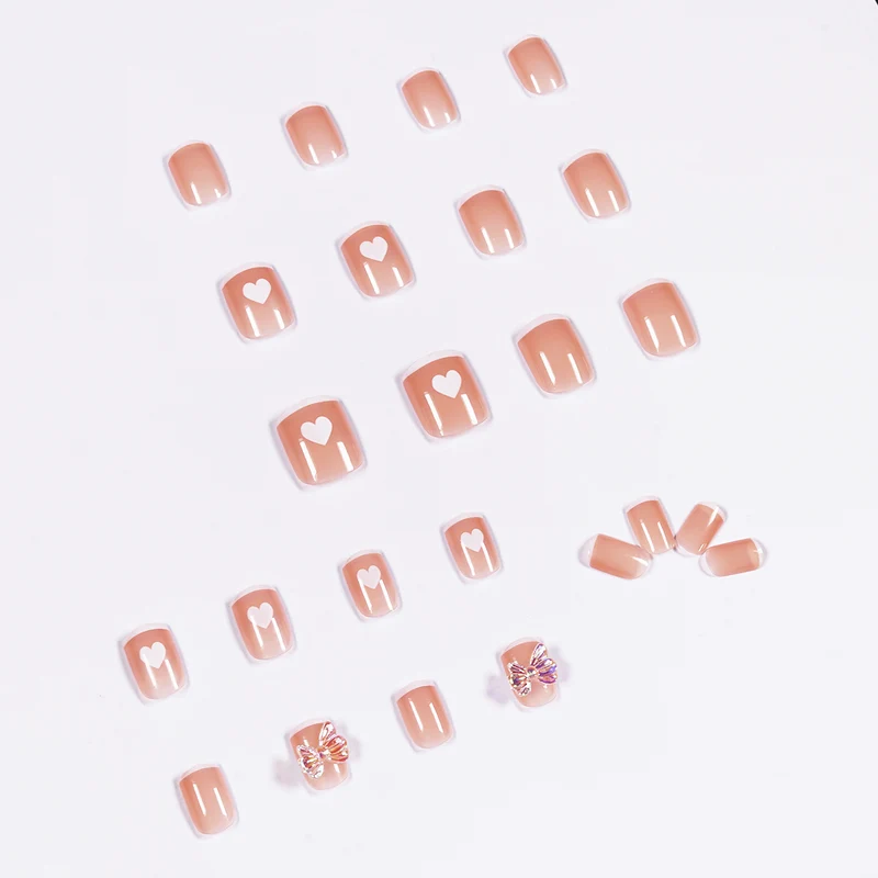 Nail art with heart and butterfly motifs Stornfield