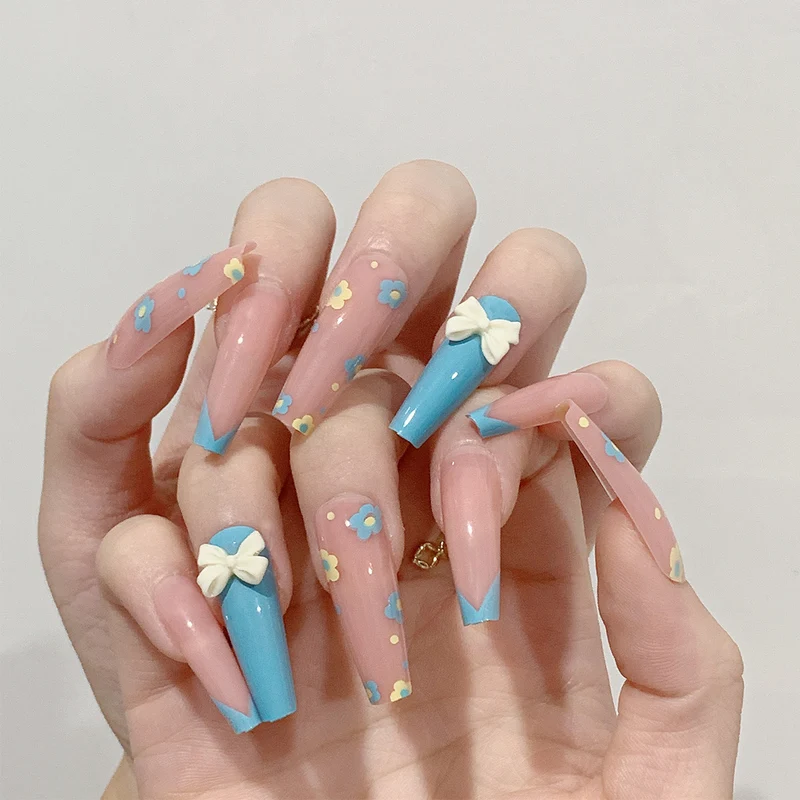Artistic and playful nail extensions with floral patterns Stornfield