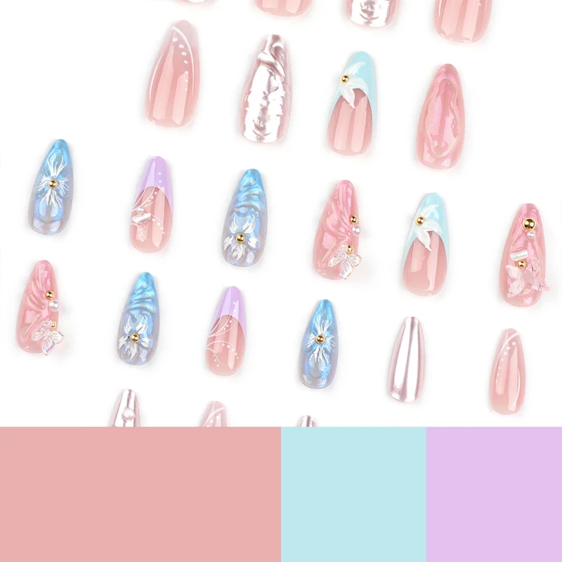 Artistic stiletto nails with delicate flower and glitter embellishments Stornfield
