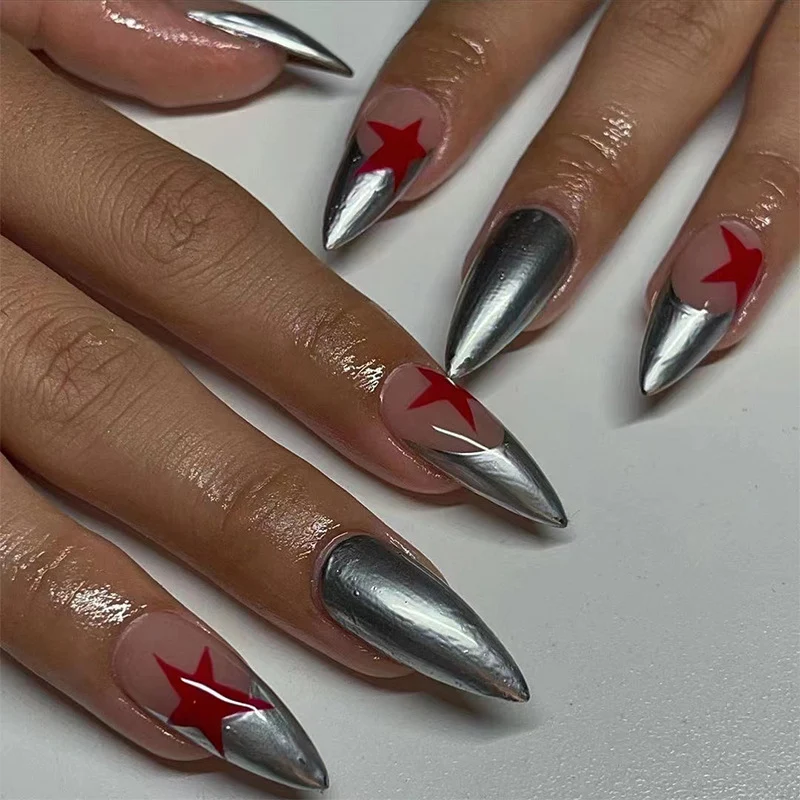 Artful stiletto nails with silver and star motifs Stornfield