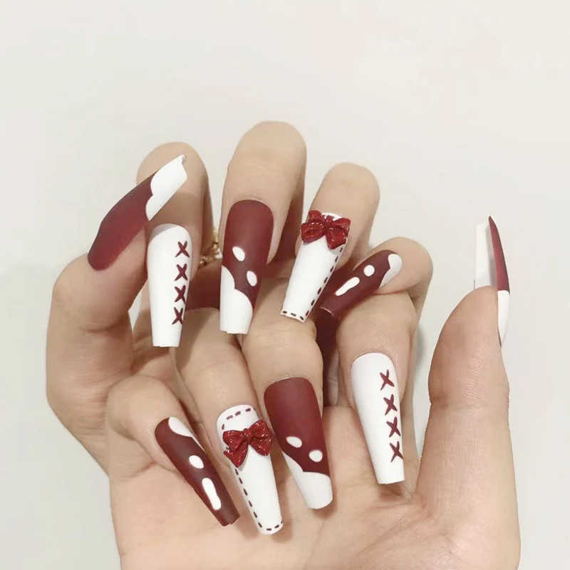 Artful stiletto nails with bow and zigzag design Stornfield