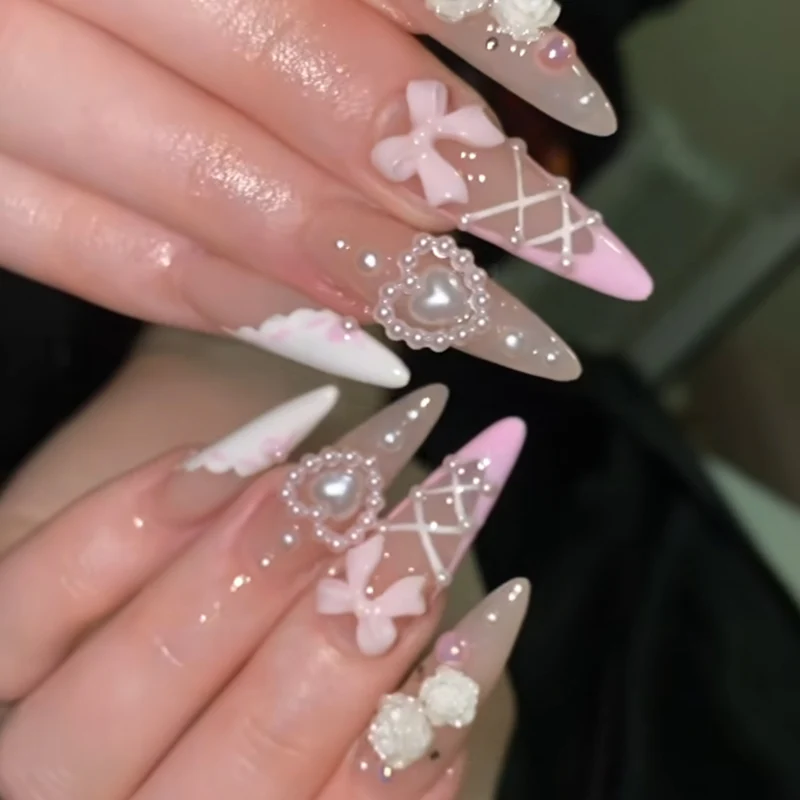 Artful stiletto nails with romantic accents Stornfield