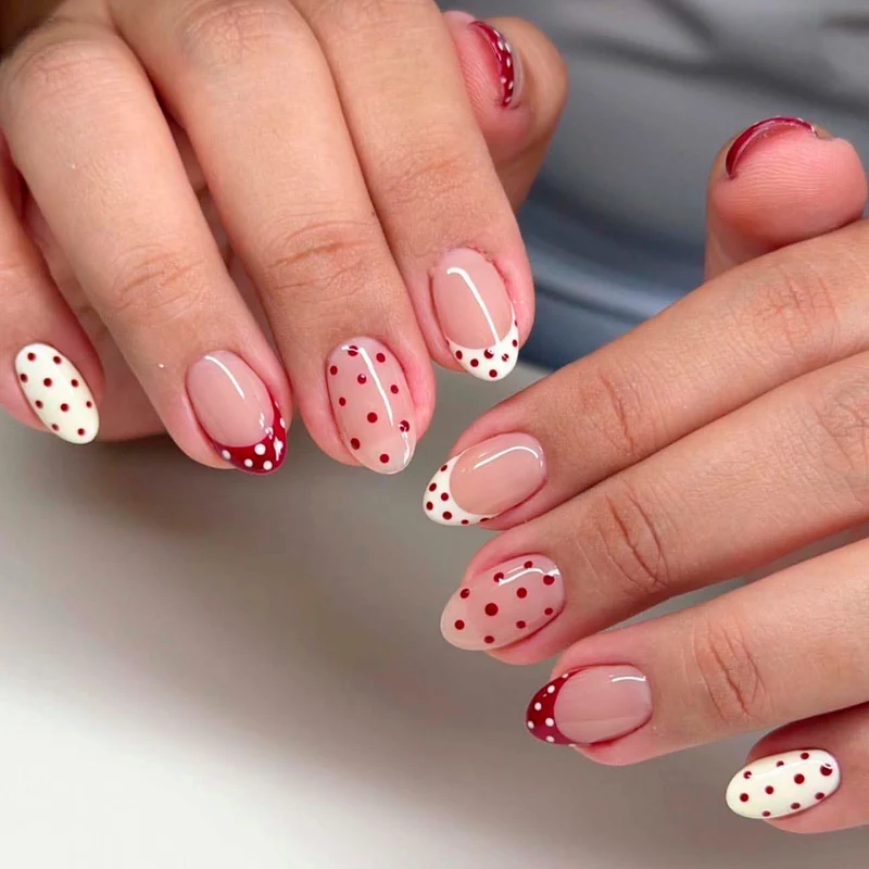 Artful stiletto nails with cute dots and accentuated color gradients Stornfield